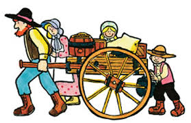 pioneer family pulling goods on a wagon